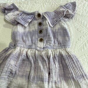 Sleeveless dress with ruffle neckline